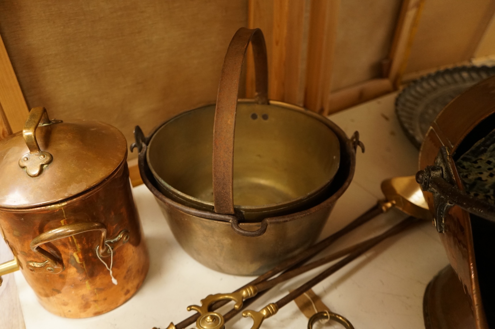 Assorted Victorian and later copper and brassware including two ships portholes, copper kettle pots, etc (16). Large porthole 36cm diameter
